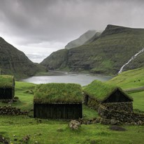 Saksun - a small village surrounded by hills and waterfalls. The lake behind the houses is part of the ocean.